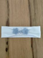 Fascia Liberty Fascia per neonata in jersey garzato con applicazioni di fiori in tessuto tinta unita e fantasia liberty. Made in Italy