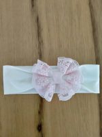 Fascia per capelli Roselline Fascia per capelli in jersey garzato con fiocco rosa in tulle e pizzo. Made in Italy