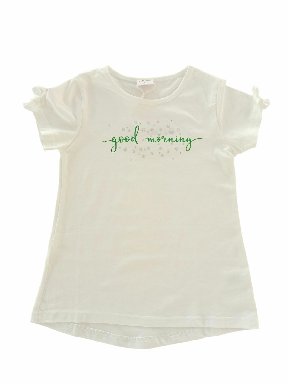 T.shirt m/c Rainforest AtivoKids C2982 00 T.shirt m/c Rainforest AtivoKids T.shirt per bambina in cotone stampa glitter, maniche corte con fiocchetto, retro con fondo stondato leggermente più lungo.
