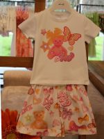 T.shirt m/corta bimba T.shirt a manica corta in cotone elasticizzato, stampa con decoro glitter, apertura posteriore con bottoncino fino alla taglia 18 mesi.